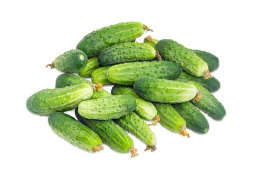 Pile of the freshly picked out cucumbers with droplets of dew on a white background
