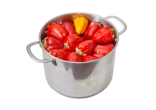 Cooked stuffed red and yellow bell peppers in the large stainless steel saucepot on a light background
