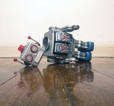 vintage bot lost his head on a old wooden floor with reflection 