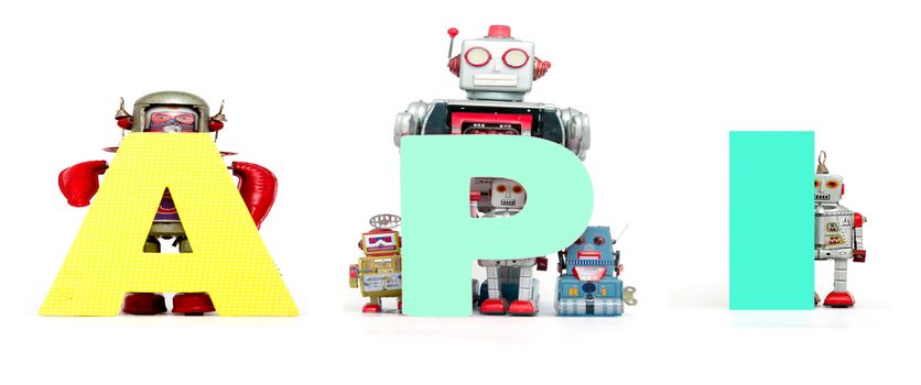 retro tin robot toys hold up the acronym API isolated on white 
