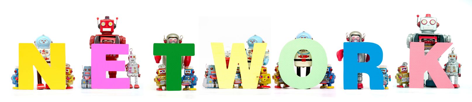 retro tin robot toys hold up the word  NETWORK solated on white banner