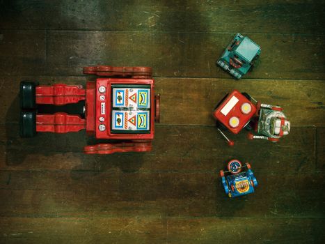 concept fixing your head with rteo robot toys on old wooden floor