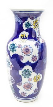 Vase painted with flower pattern againt a white background