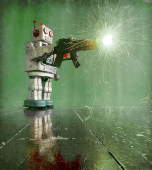 retro robot toy shoots a big gun on a wooden floor