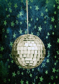 retro disco ball with stars and night sky blue background