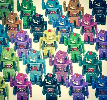 lots of color robots in a crowd with on going the other direction