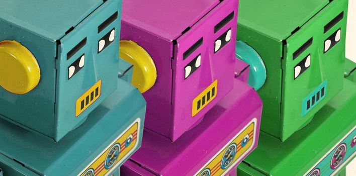 three robots  colorful looking on  macro image 