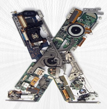 The Letter  X made up from old electronic parts