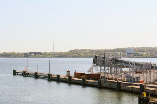 Passenger walkway at the Port of Tallinn, for boarding ferries. Tallinn TV tower can be seen in the distance, 313m tall.