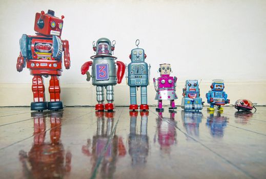 a line of retro robots on a wooden floor with reflection,