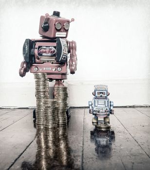 two vintage robots  with gold money on a wooden floor with reflection ,concept inequality,.