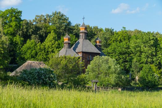 Memorial of folk wooden architecture church with domes in the museum. Uzhhorod Ukraine