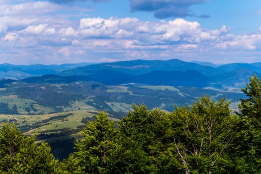 picturesque and beautiful distant blue mountains of Carpathians under the thick clouds