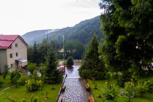 View from the hotel balcony to the nearby park area after the rain
