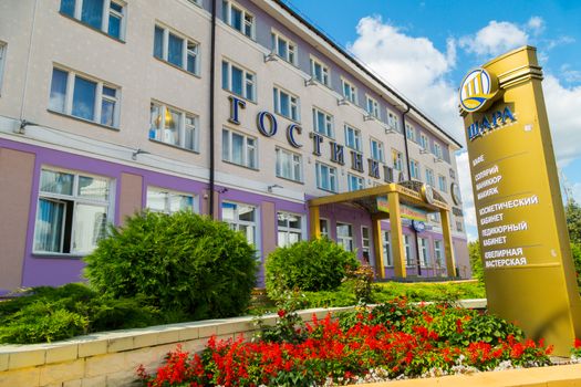 The hotel complex with a cafe, beauty salon and a jewelry workshop. Beautiful flower beds and a juicy green lawn near the entrance