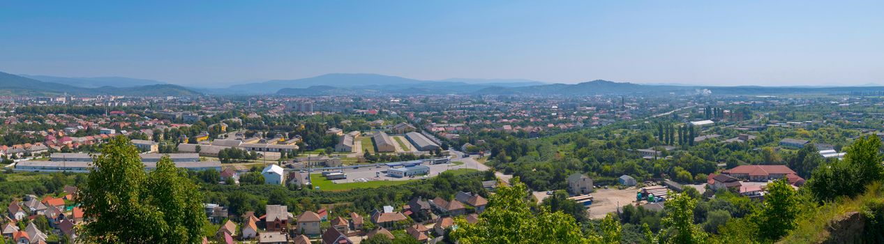 a magnificent panorama of the city with a beautiful nature lying in a green mountain valley