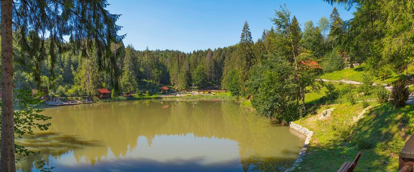 Green Lake in the middle of a large park area with houses and places for rest