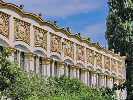 Beautiful building with decorative stucco and figures on the facade