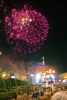 bright pink lights of beautiful fireworks in the city's night sky on Independence Square. Kiev. Ukraine