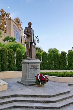 a monument to famous politician Heydar Aliyev with flowers at the foot. Kiev. Ukraine