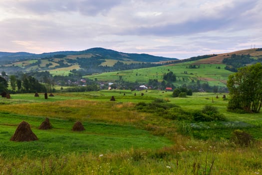 quiet village and picturesque meadows located between high ravines