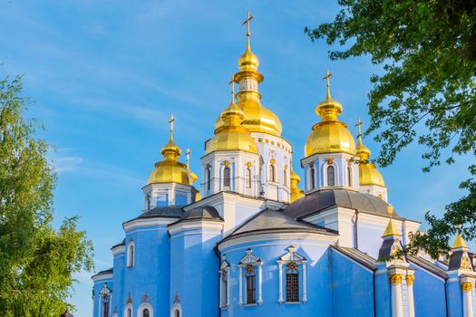 Shining in the sun temple with golden domes