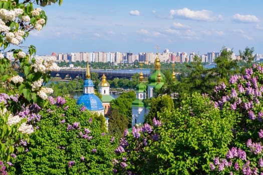 Scenic view of the golden-domed church temples and the bridge over the river