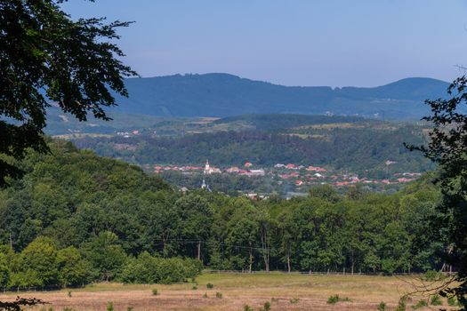 Picturesque resort village at the foot of the boundless green mountains