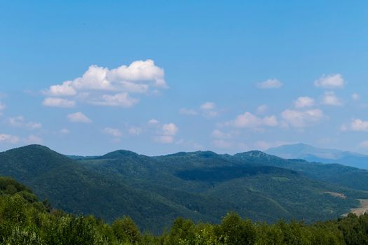 magnificent scenery of mountain slopes in the silence of a deep blue sky