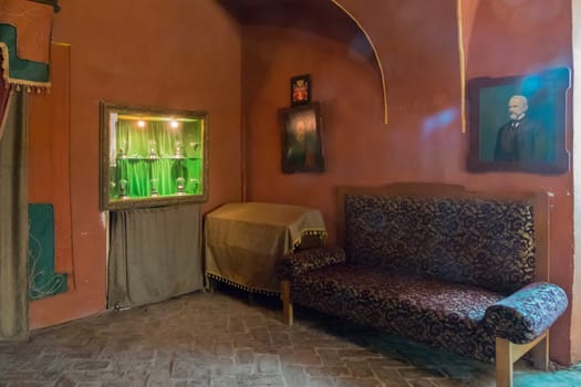 ancient portraits in the museum and exhibits illuminated by light bulbs