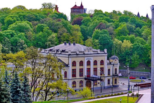White building of the philharmonic society with red window frames. There you can go to a concert and enjoy classical music