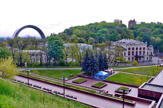 A panorama of interesting architectural constructions near the park with a blue tent for rest