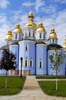St. Michael's monastery raised its golden domes into the sky blue between the clouds. Kyiv. Ukraine