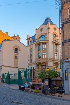 The old street is laid out with a pavement in the ancient city of Uzhhorod in the Transcarpathian region, near the renovated house