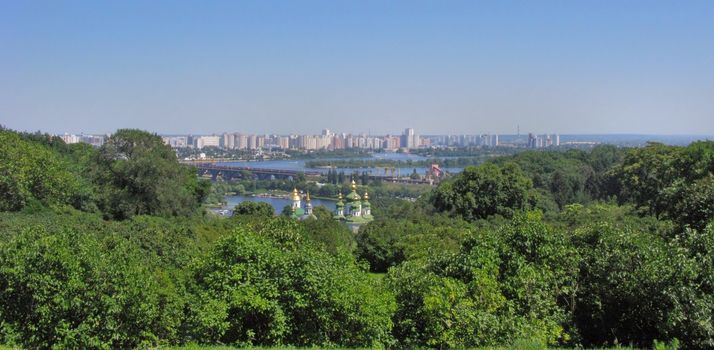 grandiose panorama of high-rise city blocks on the domes of the church