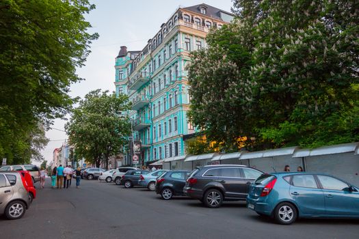 A small convenient parking for cars on the background of a modern green building