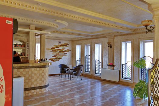 Decorated with a tiled room restaurant with wicker furniture and a bar counter