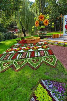 Flower bed decorated with flowers in national style. Creates a special patriotic atmosphere