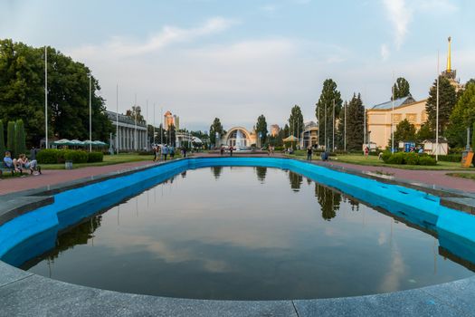 Park with a beautiful pool reflecting the sky creating romance for lovers