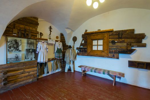 Museum exhibition showing the traditional Ukrainian hut with items of national clothes