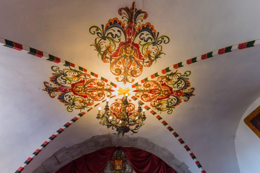painted with decorative patterns of the ceiling of a medieval rich house, a castle. historical place, sightseeing, tourism