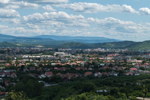 Part of the city is in shadow from the cloud, and part of it is bathed in the sun. From the height it looks just fine