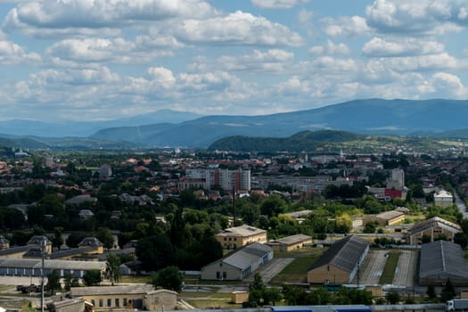 Panorama of a small city in the background of beautiful clouds