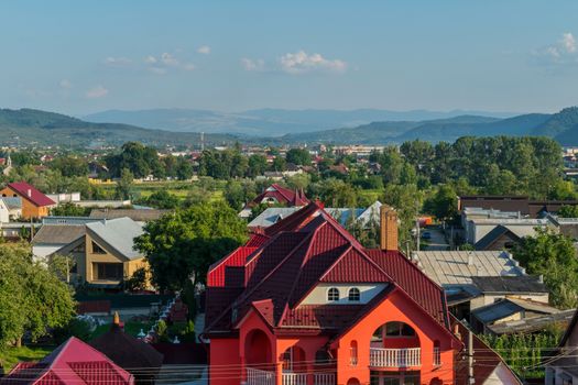 Small beautiful cozy houses on a background of green mountains. Luxury place for families