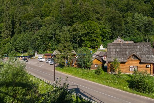 Wooden, chopped huts near a forest road. Every traveler can rest there or stay overnight