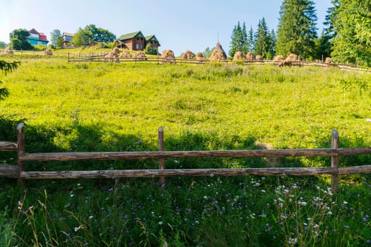 Beautiful countryside. With hay, green grass and gardens