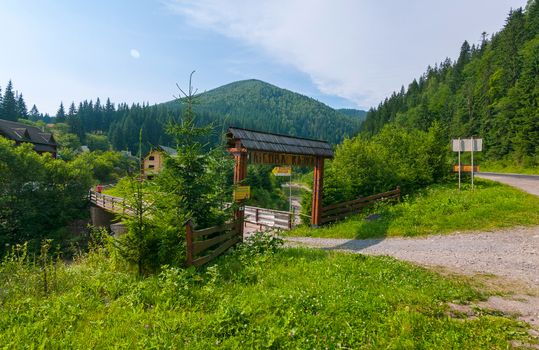 The road leading to the wooden gate entrance to the resort hotel complex