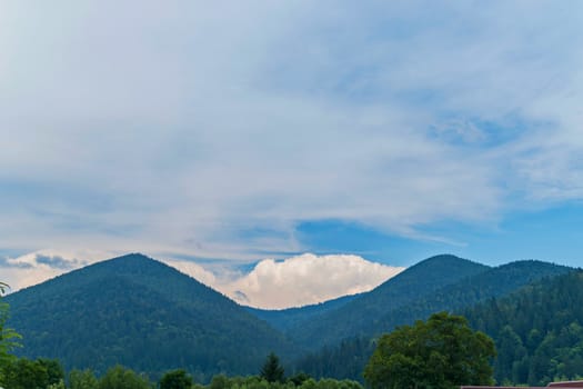 beautiful blue Carpathian mountains against the background of large cumulus clouds