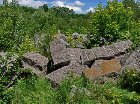Dump of large fragments of stones from former pedestals of monuments