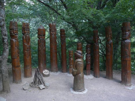 an exposition of wooden sculptures of twelve months and a girl who came to the forelimbs to the forest